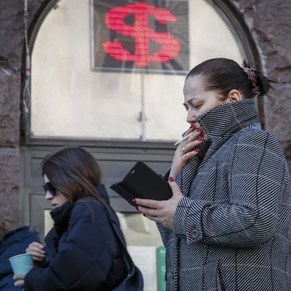 A woman walks past a currency exchange office in Moscow, Russia, on March 21. Western countries have imposed an unprecedented level of sanctions on Russia in the wake of its invasion of Ukraine. Photo: EPA-EFE