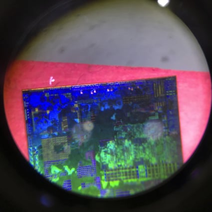 In this file photo taken May 17, 2018, a microchip developed by Tsinghua Unigroup is seen through a microscope. Photo: AP