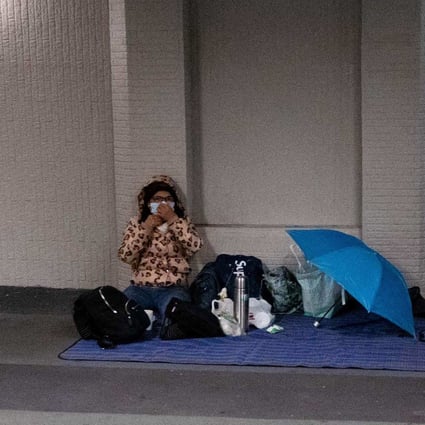 A foreign domestic worker in Hong Kong in February, amid the coronavirus outbreak. Few have suffered more during the city’s pandemic restrictions than the hundreds of thousands of women, mainly from the Philippines and Indonesia, who work as domestic helpers. Photo: AFP