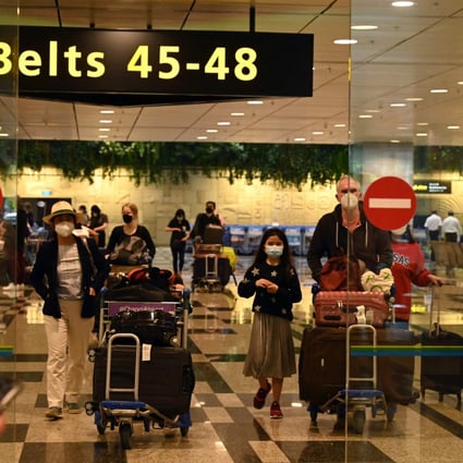 Travellers arrive at Changi Airport in Singapore. Photo: AFP