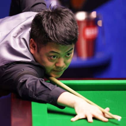 Liang Wenbo of China in a game at the World Snooker Championships event round one against Neil Robertson at the Crucible Theatre in Sheffield in England in 2021. Photo: Getty Images   