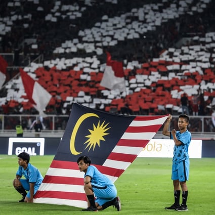 The Malaysian flag is displayed before a Fifa World Cup 2022 qualifying match against Indonesia at the Gelora Bung Karno stadium in Jakarta. Photo: Getty Images