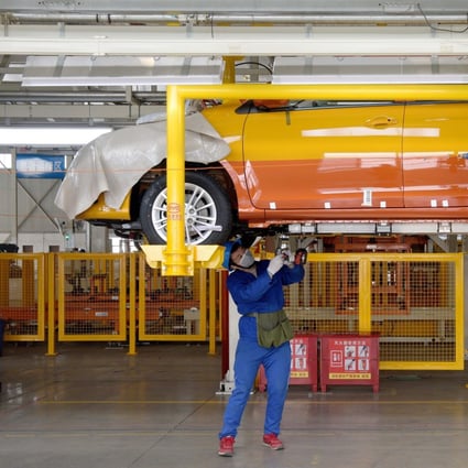 A worker works on the assembly line at a factory of vehicle manufacturer BYD in Xian. Photo: Xinhua