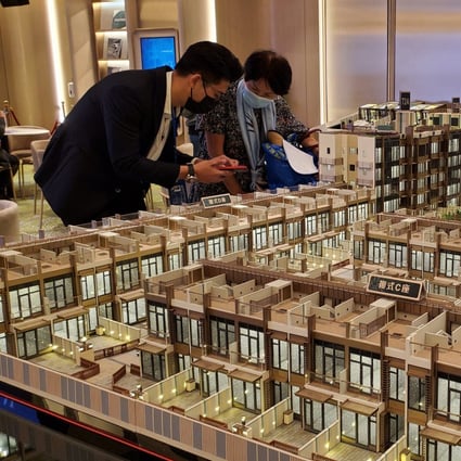 Potential homebuyers view a scale model of CK Asset’s #Lyos residential project in Hung Shui Kiu, New Territories. Photo: Edmond So