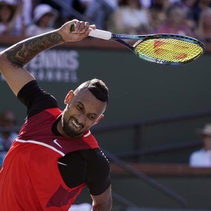 Nick Kyrgios tosses his racket after losing a point to Rafael Nadal during the BNP Paribas Open tennis tournament. Photo: AP