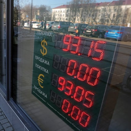 An electronic panel displays currency exchange rates for the US dollar and euro against the Russian rouble in Podolsk, Russia, on March 24. Some commentators have speculated that the “weaponisation” of the US dollar in sanctions against Russia could ultimately undermine the US currency.  Photo: EPA-EFE