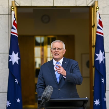 Australian Prime Minister Scott Morrison addresses the media in Canberra on Sunday. Photo: AAP Image via AP