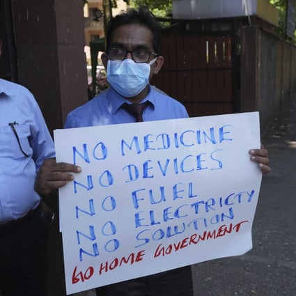 Sri Lankan government medical officers protest outside a hospital in Colombo. Professional medical organisations are warning that people will die as emergency treatment will soon not be possible if drugs and equipment are not received urgently. Photo: AP