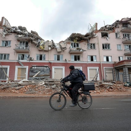 A man rides a bicycle past a hotel destroyed by a Russian airstrike in Chernihiv, Ukraine, this month. Photo: Reuters