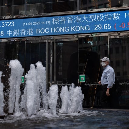 A man walks past Exchange Square in Central, Hong Kong on April 11. Photo: EPA-EFE