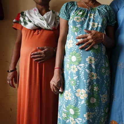Surrogate mothers pose for a photograph at a clinic near the city of Ahmedabad, in August 2013. File photo: Reuters