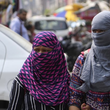 Women wear scarves around their heads amid an early heat wave in Prayagraj, Uttar Pradesh, on Wednesday. Photo: AP