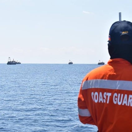 Philippine coastguard personnel monitor Chinese vessels at Sabina Shoal, a South China Sea outcrop claimed by Manila, on May 5, 2021. Photo: Philippine Coastguard/AFP