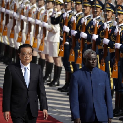 Chinese Premier Li Keqiang, left, and Solomon Islands Prime Minister Manasseh Sogavare are pictured in 2019. The US announced on Monday it was sending two top officials to the Solomons  over concerns  China could establish a military presence in the  island nation. Photo: AP Photo