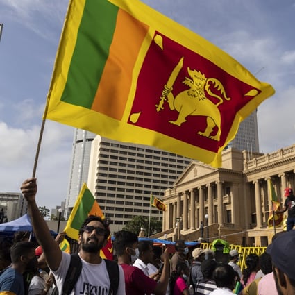 Protesters angered by sky-high inflation and lengthy power cuts call for Sri Lankan President Gotabaya Rajapaksa’s resignation 
in Colombo on Monday. Photo: Bloomberg