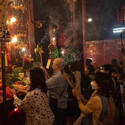 Worshipers at Man Mo Temple after it reopened on April 21. Hong Kong is beginning a slow path back to some sort of normality as the city’s worst Covid outbreak wanes. Photo: Bloomberg