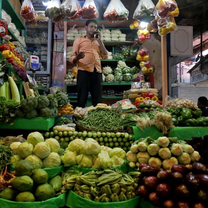 A vegetable vendor at a retail market in Kolkata, India. Photo: Reuters