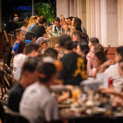 Customers at a restaurant in Robertson Quay in Singapore. Photo: Bloomberg