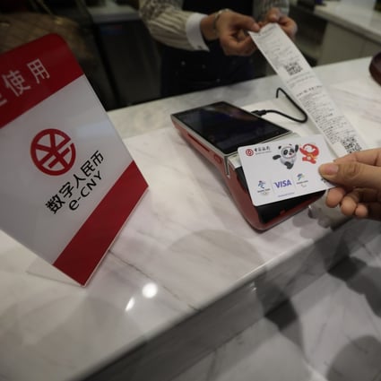 A staff demonstrates how to pay with e-CNY at a cafe in Beijing. China’s central bank is hiring a tech director to lead its digital currency initiative. Photo: Simon Song