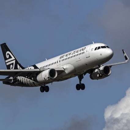 An Air New Zealand plane flies over Auckland Airport in 2020. Photo: Bloomberg