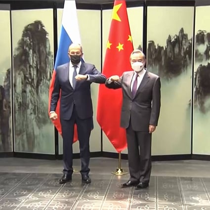 This screengrab taken on March 30, 2022 from video by state broadcaster China Central Television (CCTV) via AFPTV shows  
Russian Foreign Minister Sergei Lavrov (L) meeting his Chinese counterpart Wang Yi during his first visit to China since Moscow launched its invasion of Ukraine in February. Photo: AFP
