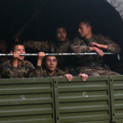 People’s Liberation Army soldiers in a truck in Garden Road, Central, Hong Kong, February 20, 2014, photographed by David Clarke for the Hong Kong in Transition archive. Photo: David Clarke