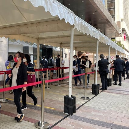 Prospective buyers queue up at The Grand Mayfair’s sales offices for a chance to own a flat in the development, where 388 flats went on sale on Friday. Photo: Ka Sing Lam