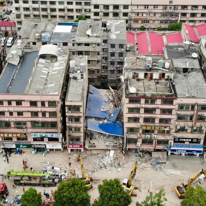 About two dozen fire trucks attend the scene of a building collapse in Changsha on Friday. Photo: CNS/AFP/China OUT