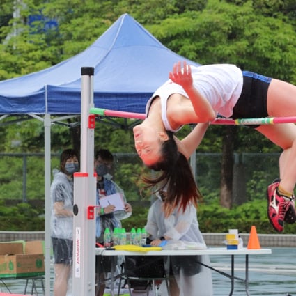 Priscilla Cheung jumping in the rain today.  Photo:  Shirley Chui