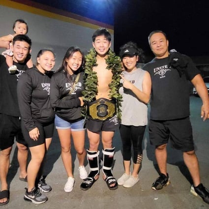 Adrian Lee celebrates winning a junior kick-boxing title alongside his family, including former ONE lightweight champion Christian Lee (left) and rising atomweight contender Victoria Lee (third left). Photo: Adrian Lee/Instagram