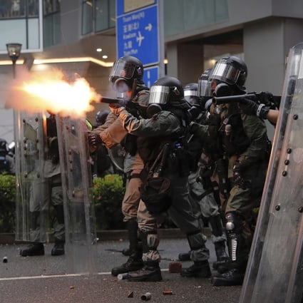 Riot police fire tear gas at protesters in Hong Kong in 2019. Photo: AP