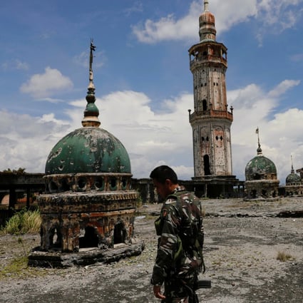 A soldier walks on a rooftop of a mosque in Marawi City. File photo: Reuters