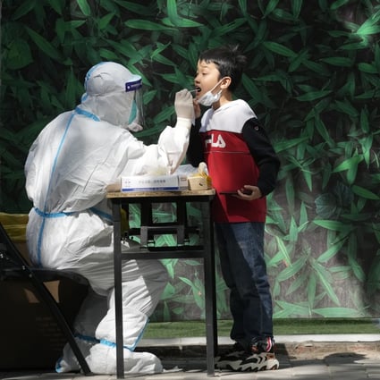 A child is swabbed during mass Covid-19 testing in Beijing on Tuesday, May 3. Photo: AP Photo