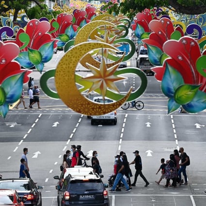 Decorations hang over a street in Singapore to celebrate Eid al-Fitr, or Hari Raya Aidilfitri, which marks the end of the Muslim fasting month of Ramadan. Photo: AFP