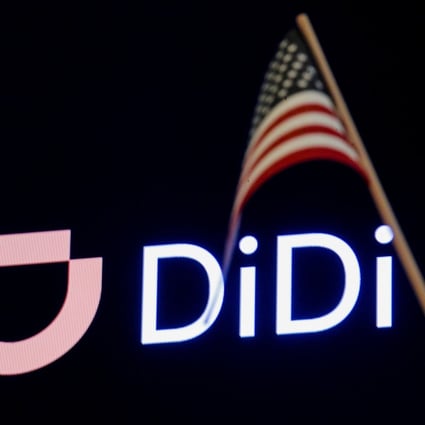 An American flag waved in front of the logo for Didi Global during its IPO on the New York Stock Exchange in New York City on June 30, 2021. Photo: Reuters