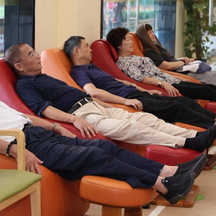 People relax on massage sofas at a senior care centre in Shanghai. File photo: Xinhua