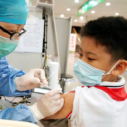 Researchers at Fudan University’s children’s hospital in Shanghai say vaccinated children are significantly less likely to show symptoms if they are infected with Covid-19. Photo: Xinhua