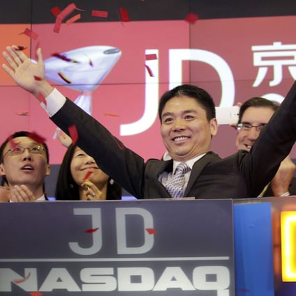 Richard Liu Qiangdong raises his arms to celebrate the IPO of his company JD.com at the Nasdaq MarketSite in New York on May 22, 2014. JD.com recently said it had approved its first dividend since going public. Photo: AP