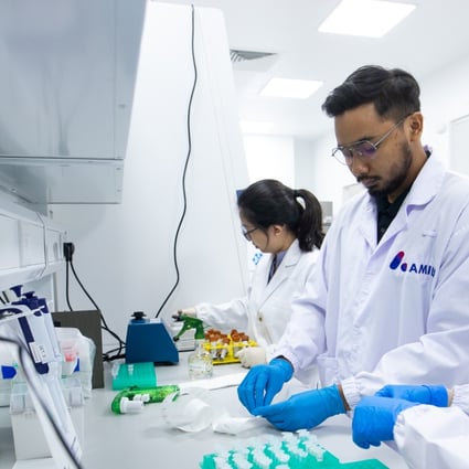 Researchers work at Amili’s lab in Singapore. Photo: Handout