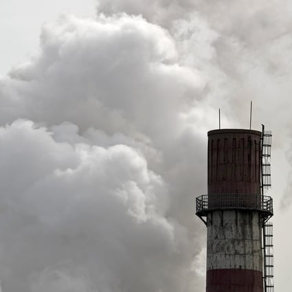 Billows of steam and smoke are emitted from a coal-fired power plant in Beijing in February 2017. China’s carbon emissions trading market is estimated to be three times bigger than the European Union’s. Photo: AP