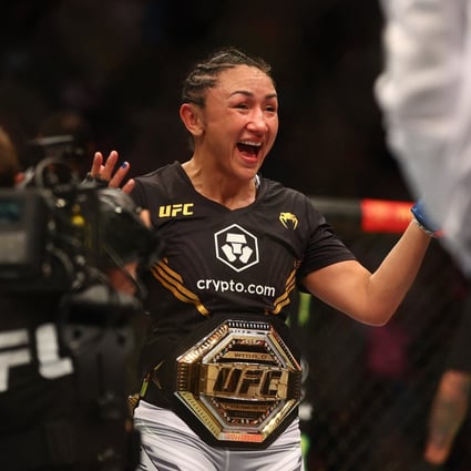 Carla Esparza reacts to her championship victory against Rose Namajunas at UFC 274. Photo: USA TODAY Sports