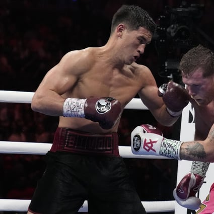 Dmitry Bivol connects with a left to the jaw of Canelo Alvarez during their light heavyweight title fight in Las Vegas. Photo: AP