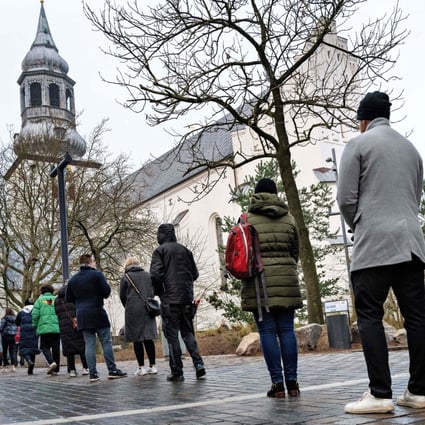 People queuing for a rapid test in Aalborg, Denmark in December 2021. File photo: AFP