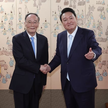 Chinese Vice-President Wang Qishan (left) shakes hands with South Korean President Yoon Suk-yeol at his office in Seoul on Tuesday after the inauguration ceremony. Photo: EPA-EFE