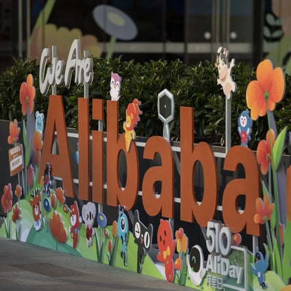 A child views a sign of Alibaba Group Holding's at its headquarters in Hangzhou, capital of eastern Zhejiang province, on May 8, 2021. Photo: Bloomberg