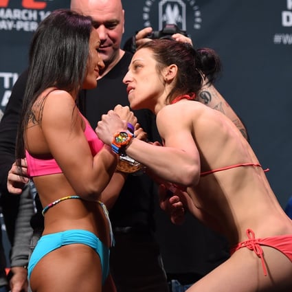 Carla Esparza (left) and Joanna Jedrzejczyk face off during the UFC 185 weigh-ins in Dallas in 2015. Photo: Getty Images
