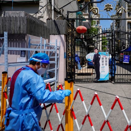 The entrance of a residential area is closed off during a lockdown in Shanghai on May 5. Lockdowns in major Chinese cities are just one of several factors weighing on sentiment towards the Chinese economy and equities. Photo: Reuters