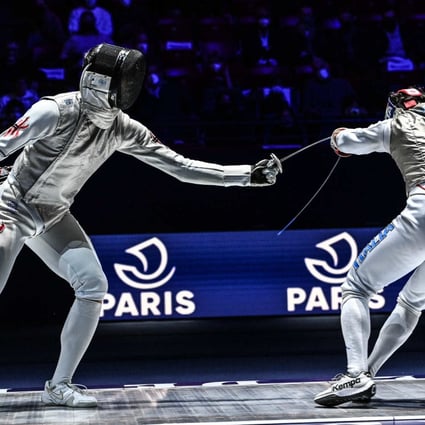 Cheung Ka-long (left) defeats Edoardo Luperi of Italy in the World Cup in Paris early this year. Photo: FIE