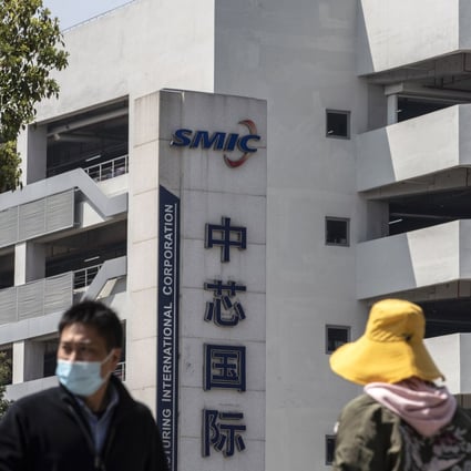 Pedestrians walk past the Semiconductor Manufacturing International Corp (SMIC) headquarters in Shanghai on March 23, 2021. Photo: Bloomberg