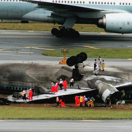 Investigators inspect the wreckage of the plane. Photo: Oliver Tsang
